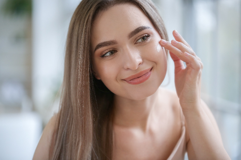 A calm, unhurried skincare moment in soft natural light